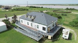 Roofing construction in Angleton, TX. Removal of old shingles.